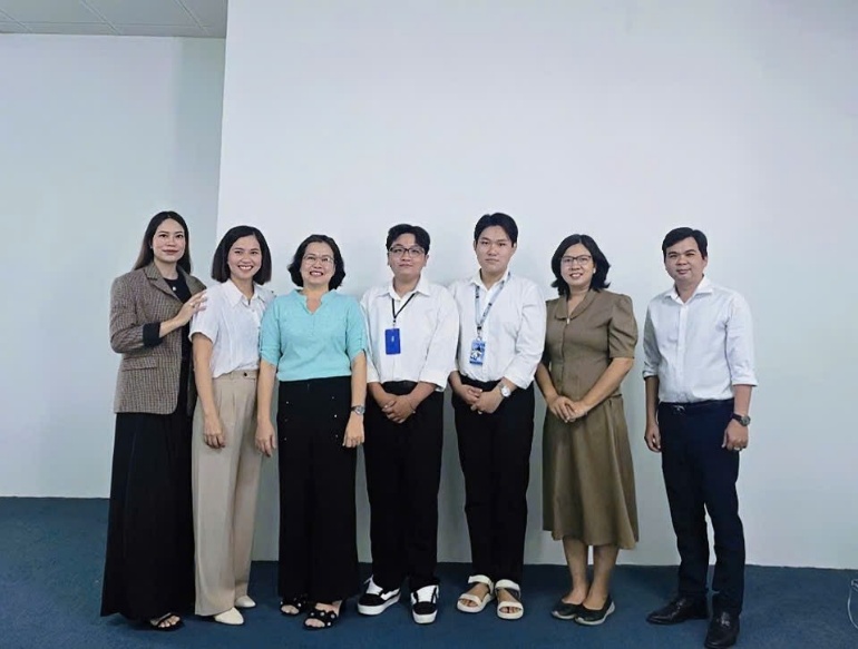 A group of people standing togetherDescription automatically generated